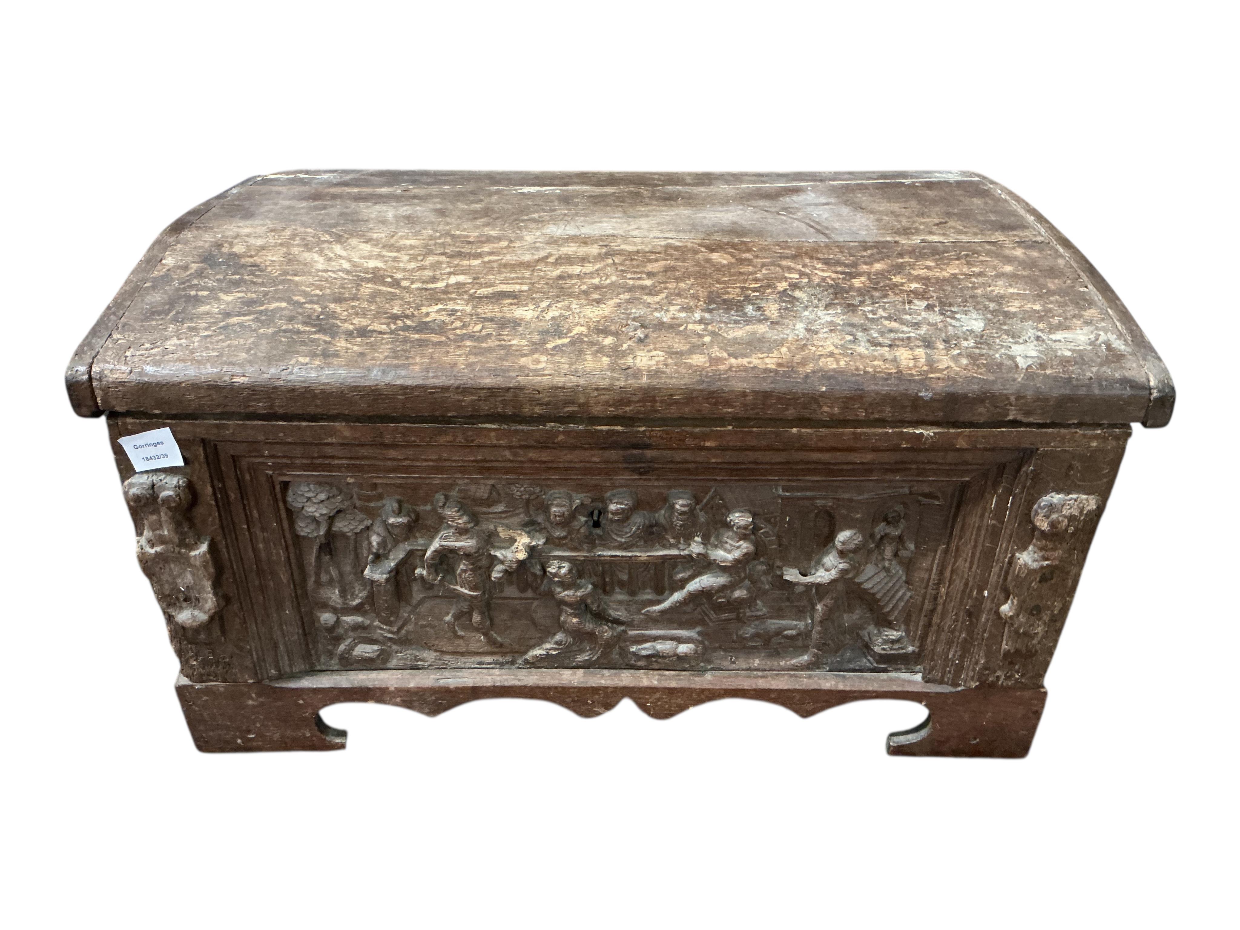 A small 17th century style carved oak domed top trunk, width 79cm, depth 50cm, height 41cm